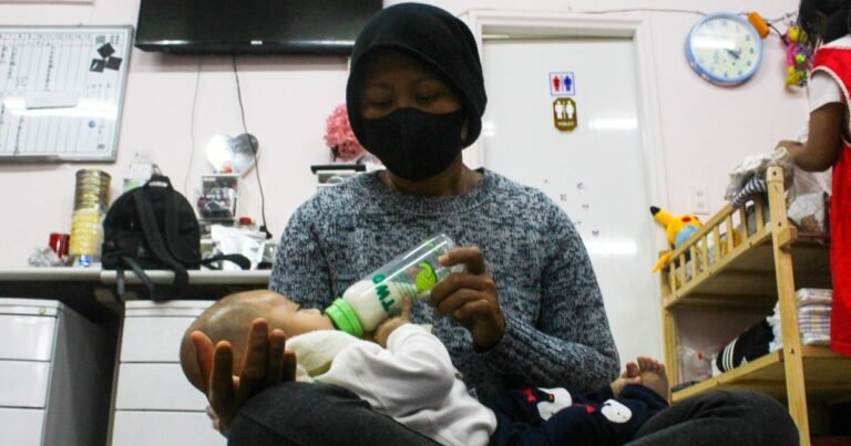 Migrant nanny feeds baby 1751871950 24b805 1751873444.jpg